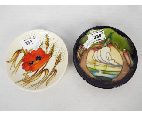 Moorcroft - Two Moorcroft Pottery coasters, the first decorated in the Harvest Poppy pattern, the other New Dawn, impressed a
