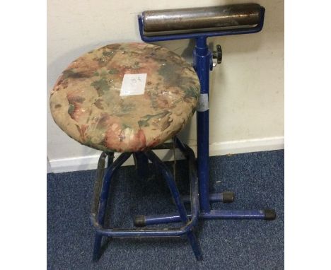 A metal stool together with a roller. Est. £20 - £30.