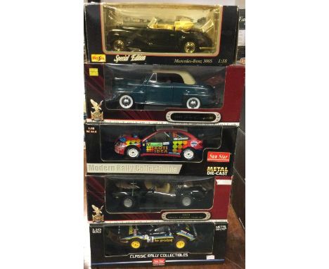 Five various 1:18 scale boxed model cars. Est. £20 - £30.