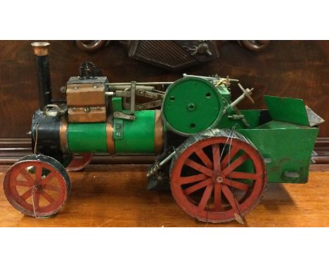 A good copper mounted traction engine of typical form. Est. £20 - £30.