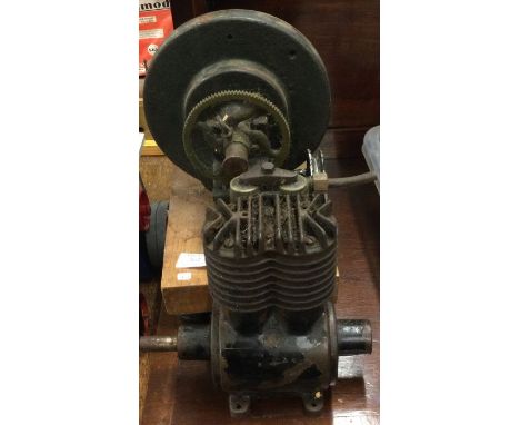 An old cast iron engine together with one other. Est. £20 - £30.
