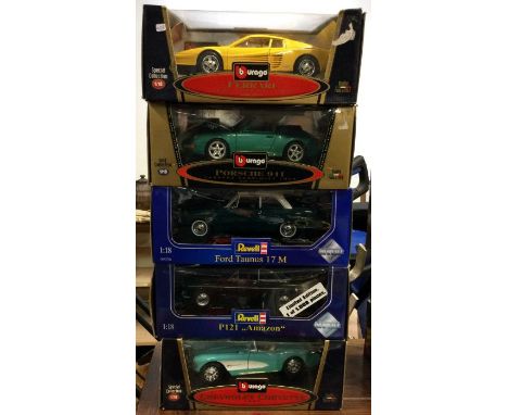 Five various 1:18 scale boxed model cars. Est. £20 - £30.