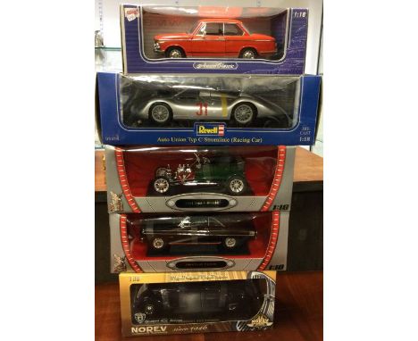 Five various 1:18 scale boxed model cars. Est. £20 - £30.