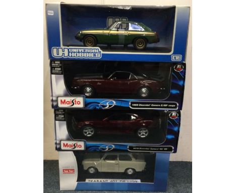 Four various 1:18 scale boxed model cars. Est. £20 - £30.