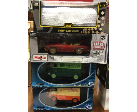 Four various 1:18 scale boxed model cars. Est. £20 - £30.