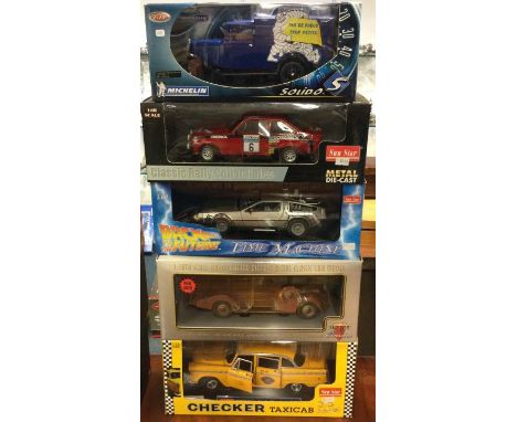 Five various 1:18 scale boxed model cars. Est. £20 - £30.