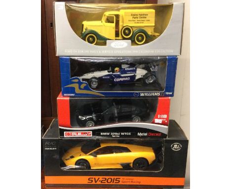 A 1:14 scale boxed Lamborghini model car together with three other boxed model cars. Est. £20 - £30.