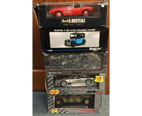 Five various 1:18 scale boxed model cars. Est. £20 - £30.