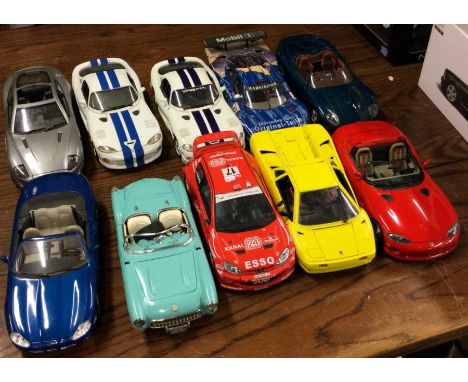 Ten various unboxed 1:18 scale model cars. Est. £20 - £30.