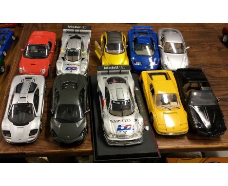 Ten various unboxed 1:18 scale model cars. Est. £20 - £30.