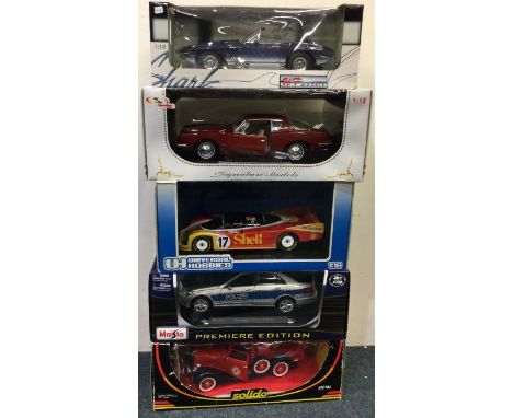 Five various 1:18 scale boxed model cars. Est. £20 - £30.