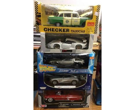 Six various 1:18 scale boxed model cars.. Est. £20 - £30.