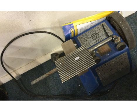 A Tormex bench grinder. Est. £20 - £30.