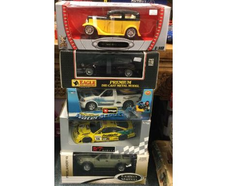 Five various 1:18 scale boxed model cars. Est. £20 - £30.