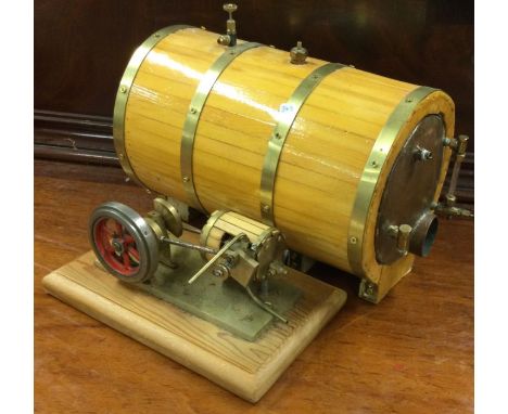 A good copper and brass mounted tank together with a matching stationary steam engine. Est. £20 - £30.
