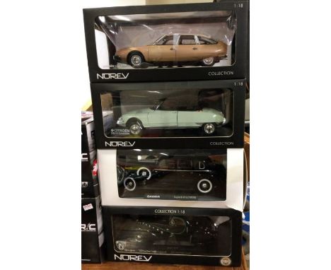 NOREV: Four various 1:18 scale boxed model cars. Est. £20 - £30.