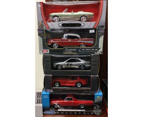 Five various 1:18 scale boxed model cars. Est. £20 - £30.