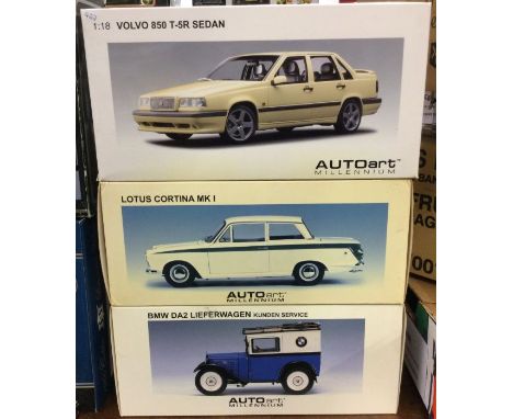 AUTO ART: Three various 1:18 scale boxed model cars. Est. £20 - £30.