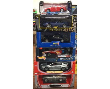 Five various 1:18 scale boxed model cars. Est. £20 - £30.