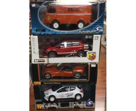 Four various 1:18 scale boxed model vehicles. Est. £20 - £30.