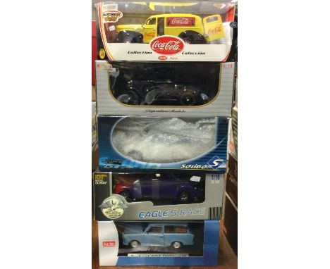 Five various 1:18 scale boxed model cars. Est. £20 - £30.