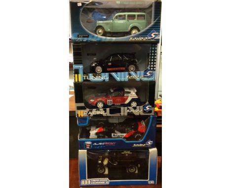 Five various 1:18 scale boxed model cars. Est. £20 - £30.