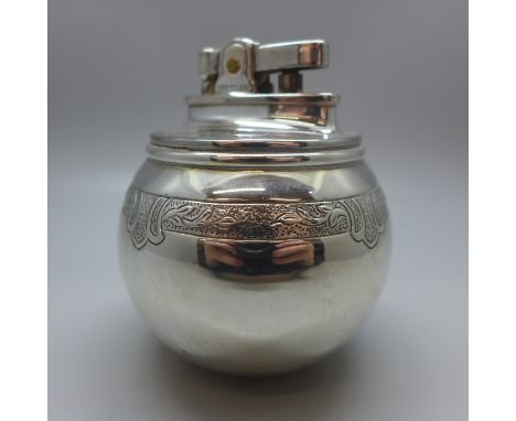 A globular silver table lighter, London 1956, maker RC, William Comyns &amp; Sons 