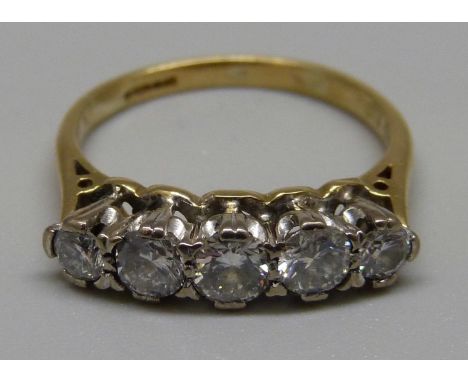 An 18ct gold and five stone diamond ring, approximately 0.75 carat diamond weight, 3.1g, K 