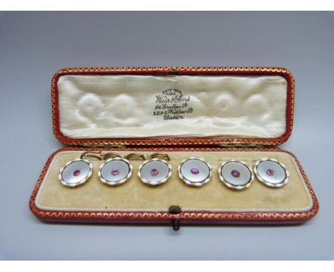A cased set of six 9ct gold, ruby, mother of pearl and enamel buttons, 15mm diameter, (4 fasteners) 