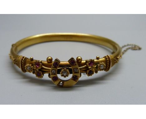 A Victorian 15ct gold, diamond and ruby horseshoe bangle, Chester 1892, 10.2g, cased 