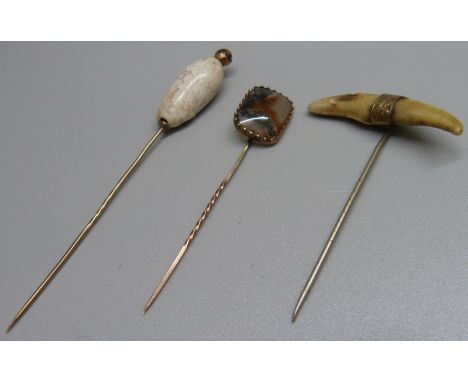 Three stick pins including one set with moss agate 