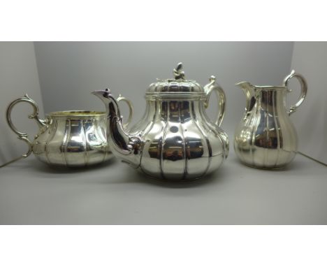 A Victorian silver three piece tea service, London 1855 and 1860, maker BP, 1170g 