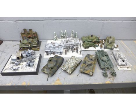 Four plastic model dioramas of WWII soldiers and five military vehicles 