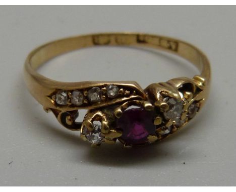 An 18ct gold, red stone and diamond ring, 2.7g, R 