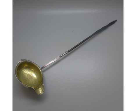 A George III silver gilt ladle, London 1785, incuse duty mark 