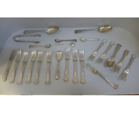 A collection of silver and white metal King's pattern flatware, 1,167g of hallmarked silver, (four white metal spoons 190g) 