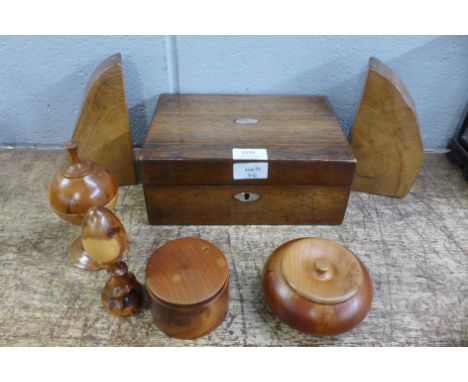 A Georgian inlaid tea caddy, a workbox, a pair of wooden bookends and a collection of treen