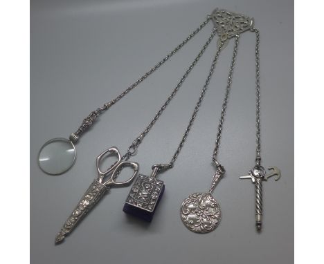 A silver chatelaine, Birmingham 1900, various hallmarks on the tools 