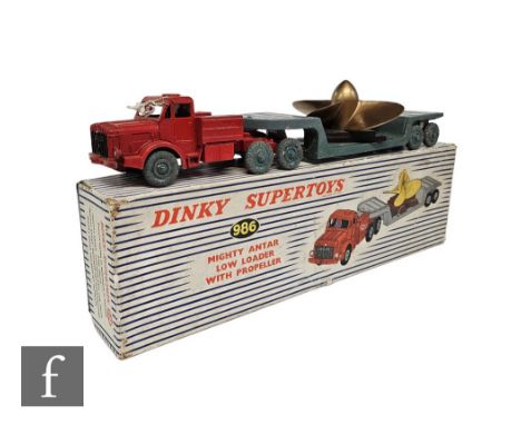 A Dinky 986 Mighty Antar Low Loader with Propeller Load, in red (some repainting) with grey Supertoy hubs, black grille, ligh