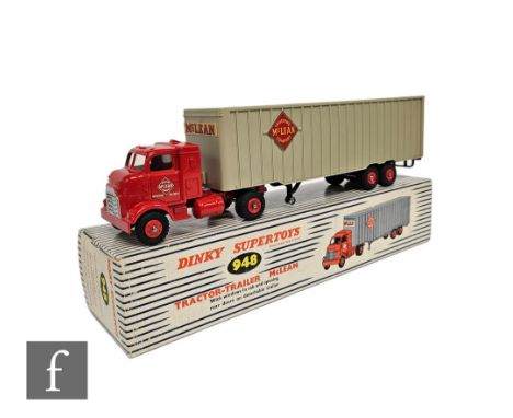 A Dinky 948 Tractor-Trailer McLean, with red cab and plastic hubs, plastic trailer with metal base chassis, in a blue and whi