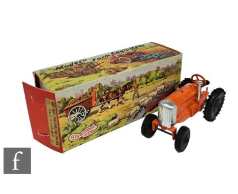 A Crescent 1805 Tractor in orange with silver trim and black wheels, in picture box. 