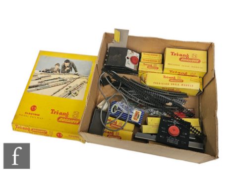A TT gauge Triang T9 train set, with a selection of boxed accessories including an engine shed. 