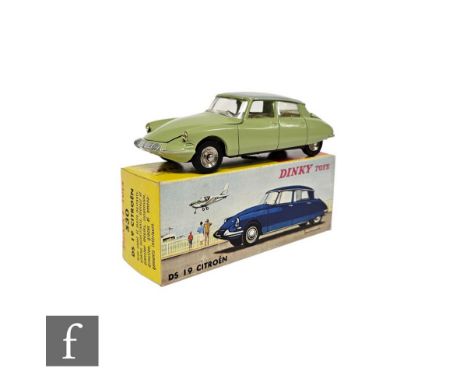 A French Dinky 530 Citroen DS19 in avocado green with light grey roof, ivory interior with black steering wheel, matt black b