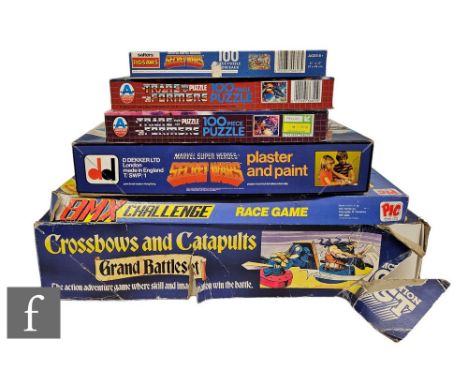 A collection of toys and games, comprising Action GT Crossbows and Catapults, Pic Toys BMX Challenge, Dekkertoys Marvel Super