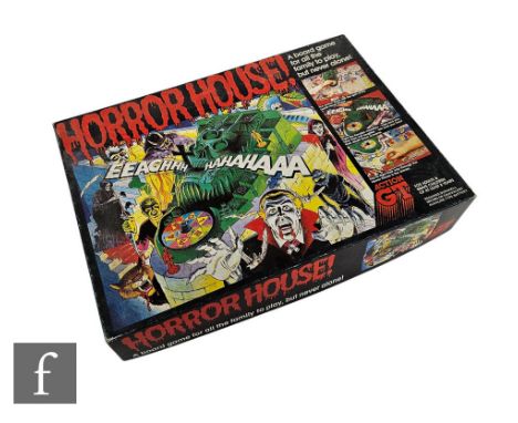 A 1980s Action GT Horror House board game, near complete, comprising board, death head wheel, six king of demon cards, thirty