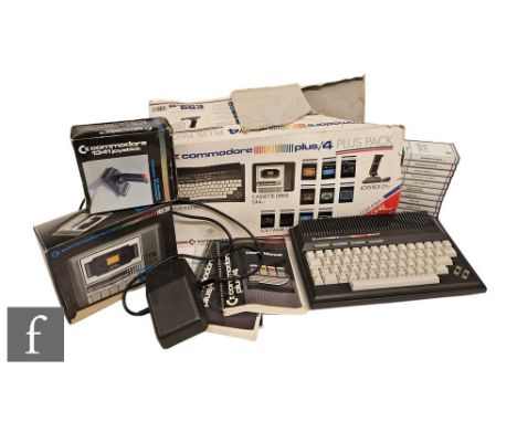 A Commodore Plus/4 with a selection of games and accessories, to include Exorcist, Treasure Island, Space Sweep and Invaders 