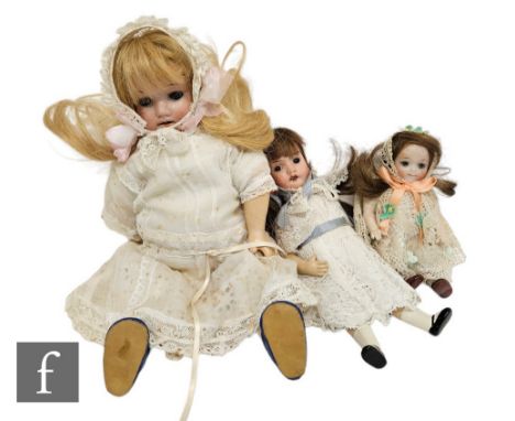A Hermann Steiner bisque socket head doll with sleeping blue eyes, painted lashes, open mouth with four teeth, head impressed