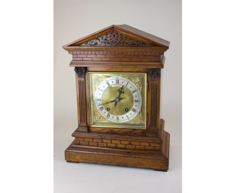 A Black Forest mantel clock, gilt metal dial with silvered chapter ring, marked Lyons & Sons, Exeter, in architectural case, 