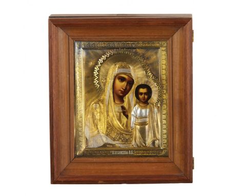 Icon Our Lady of Kazan in a silver setting with gilding and an old wooden icon cover.Hallmarks: letters EU unknown master, th