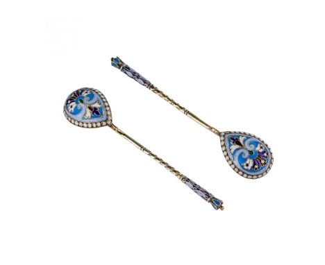 A pair of Russian silver spoons with a twisted handle and a teardrop-shaped spatula. Decorated with gilding, floral and geome